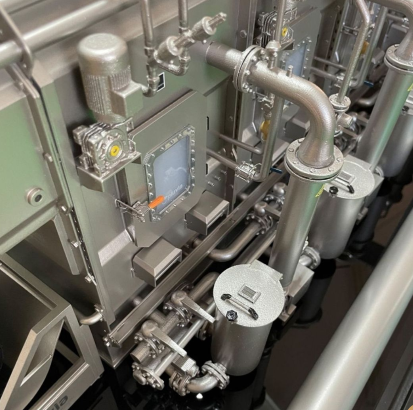 A highly detailed industrial model created by ARI Model, replicating an entire factory complex with automated assembly lines, intricate infrastructure, and advanced machinery. This model is used for corporate presentations, engineering simulations, a