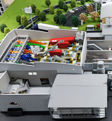 A high-precision industrial model developed by ARI Model, featuring a detailed factory layout with machinery, production lines, and infrastructure components. This model is used in factory planning, engineering simulations, and product prototyping, d