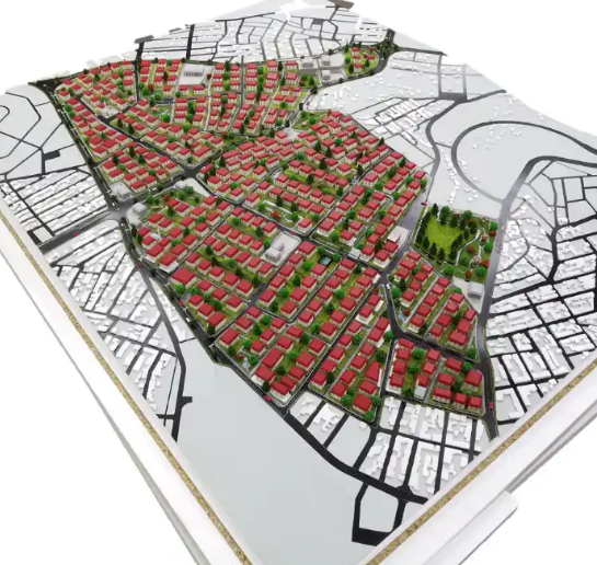 An incredibly detailed physical model created by ARI Model for a city-scale plan exposition at Salon des Maires, including modular building blocks, green zones, transportation infrastructure, and energy-efficient layouts illuminated by LED lights. De