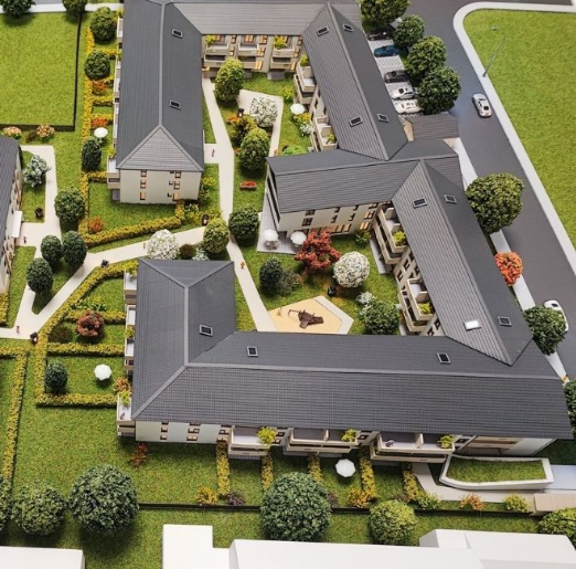 A custom-built illuminated and animated scale model by ARI Model, on display at Immo Messe Schweiz. The model is enriched with high-end lighting systems, motor-driven movement, authentic texture, and natural landscaping visually translating architect