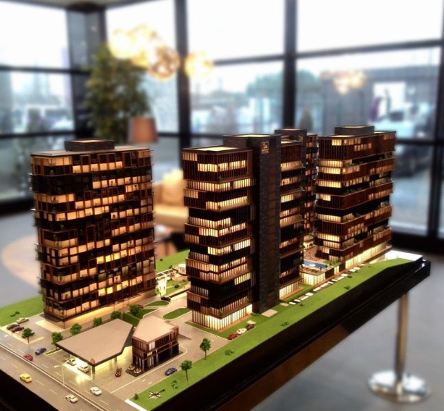 Custom architectural scale model designed by ARI Model for Foire du Voyage, featuring high-quality materials, lighting, and motion components. This detailed and interactive display transforms complex architectural concepts into tangible, visually eng