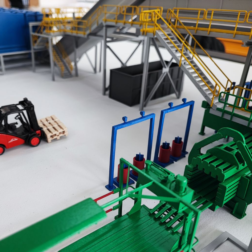 A customized architectural exhibition model designed by ARI Model for the Supply Chain Event, featuring lighting, animations, and architectural precision. ARI Model combines engineering knowledge and artistic craftsmanship to bring logistics, automat